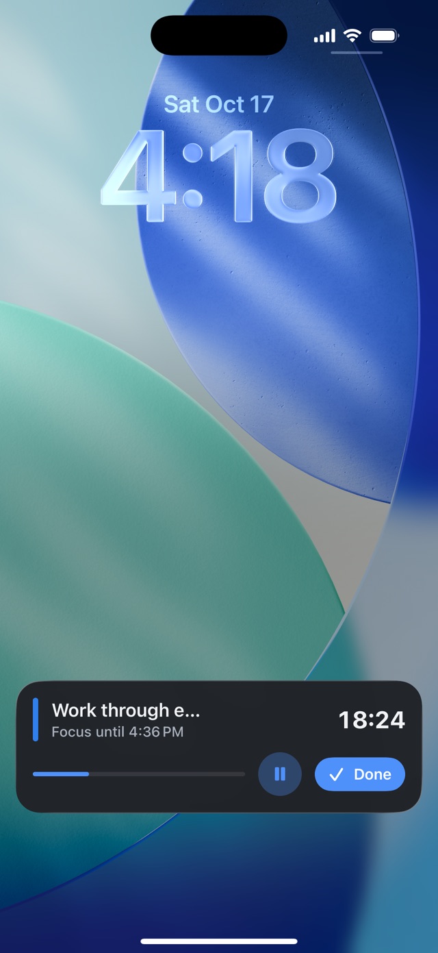 Lock Screen with a Live Activity: focus on “Work through emails” with time left, Pause and Done